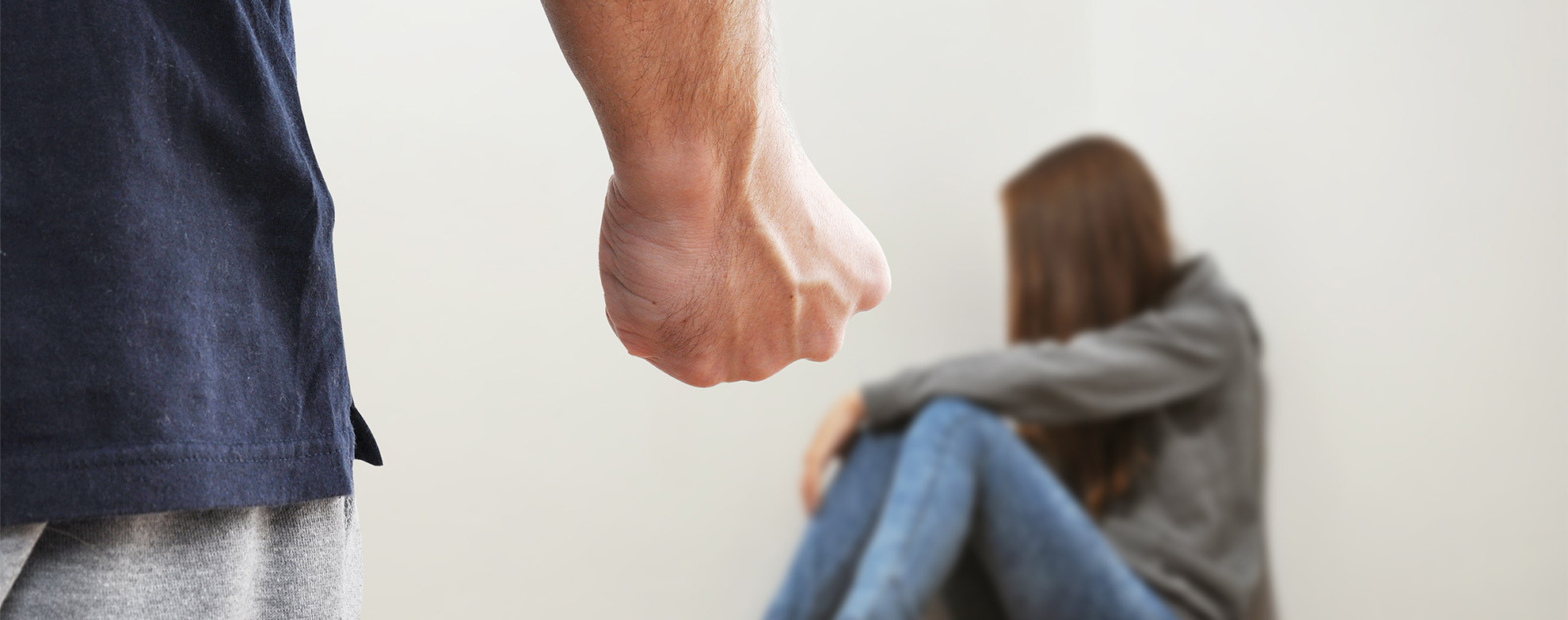 Fist of adult man prepared to hurt the child because of domestic violence